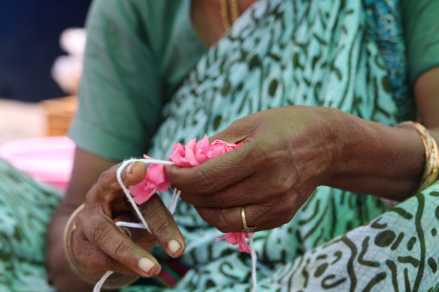 Out of Eden Learn student AmazonBoxGuy in Chennai, India photographs a woman creating a string of flowers (part of the “Documenting the Everyday” footstep).